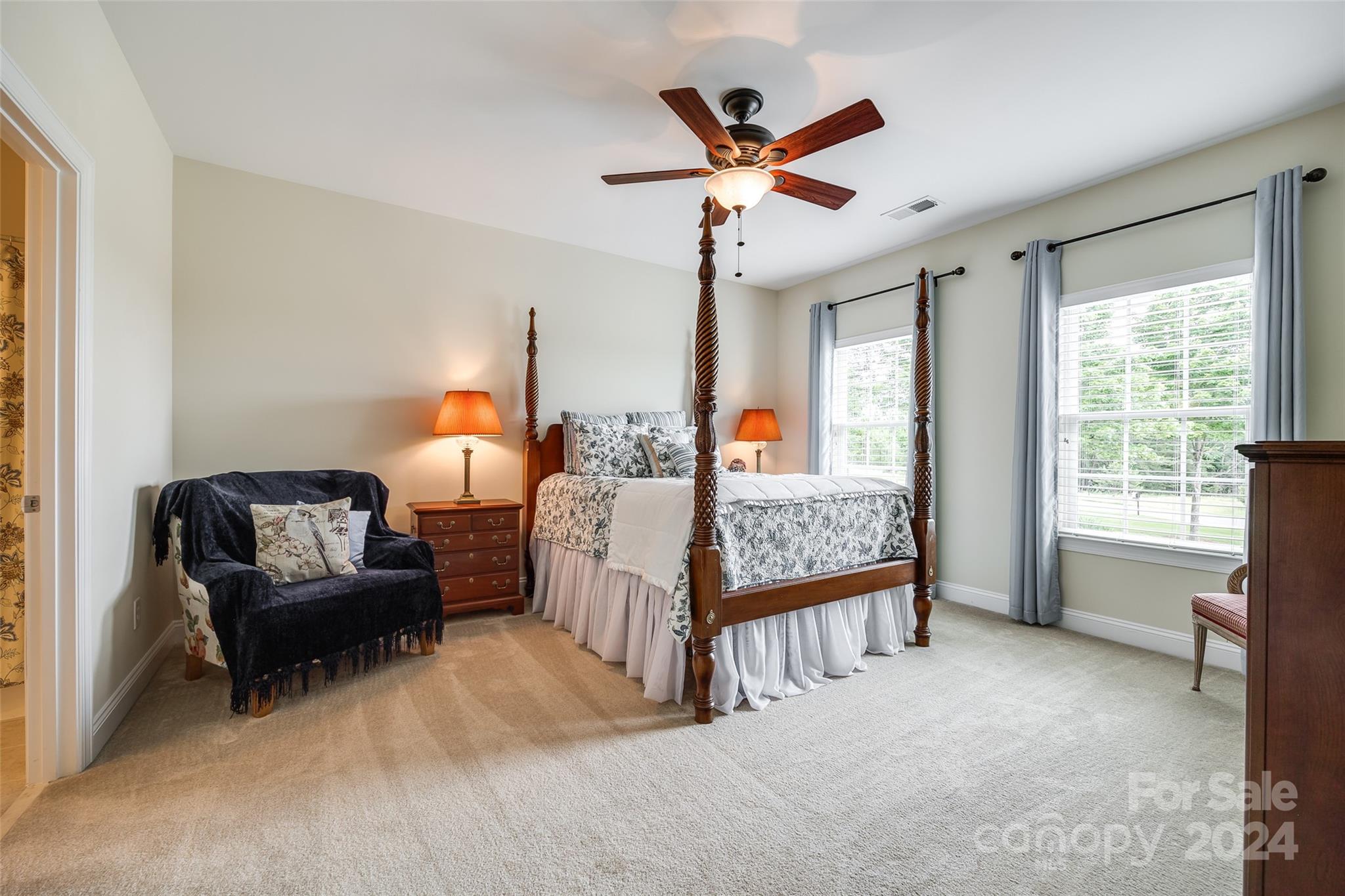 352 Calming Way Tega Cay, SC 29708 - Photo 29 of 48 a bedroom with furniture and a large window