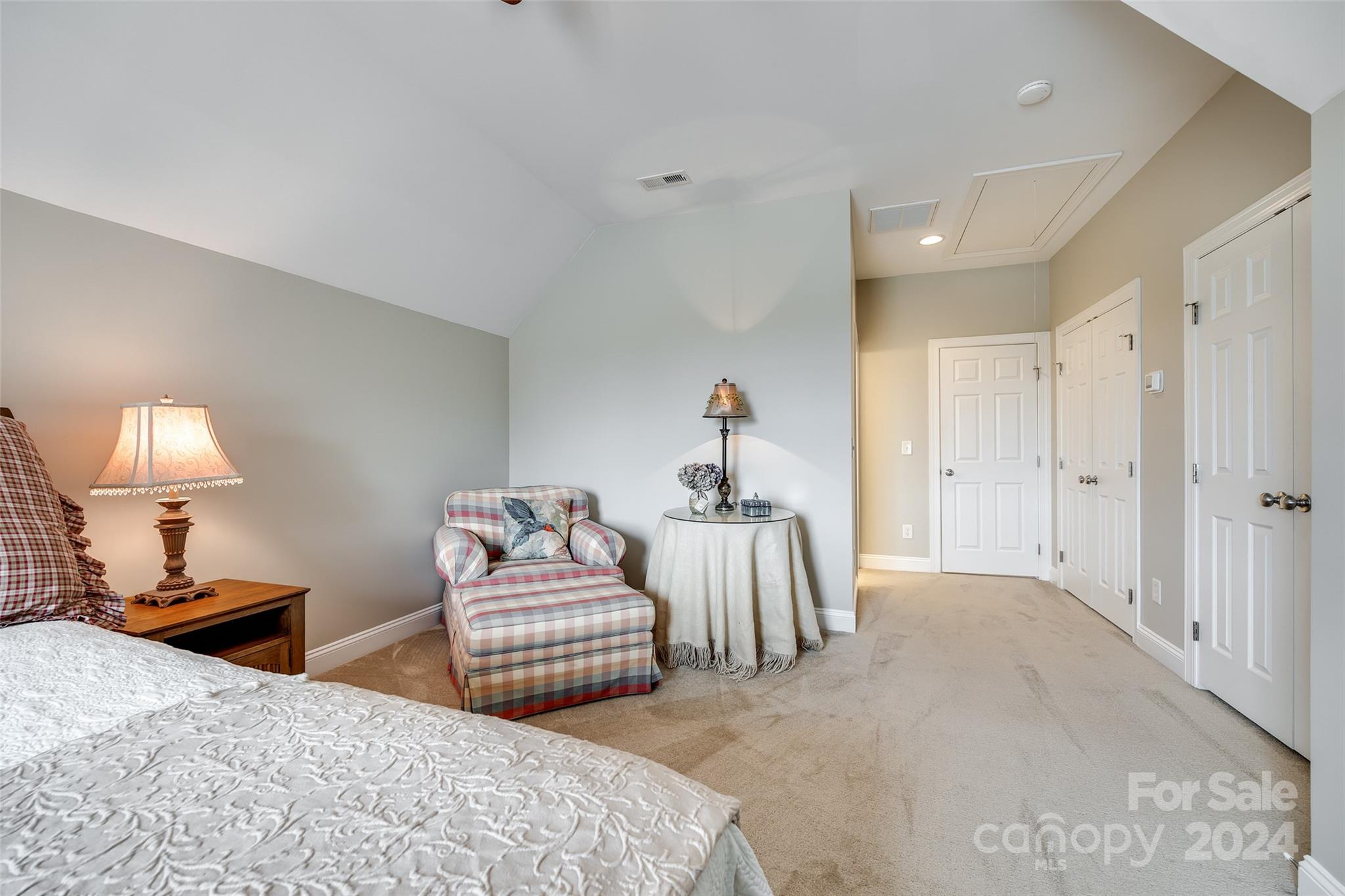 352 Calming Way Tega Cay, SC 29708 - Photo 33 of 48 a bedroom with two beds and a lamp