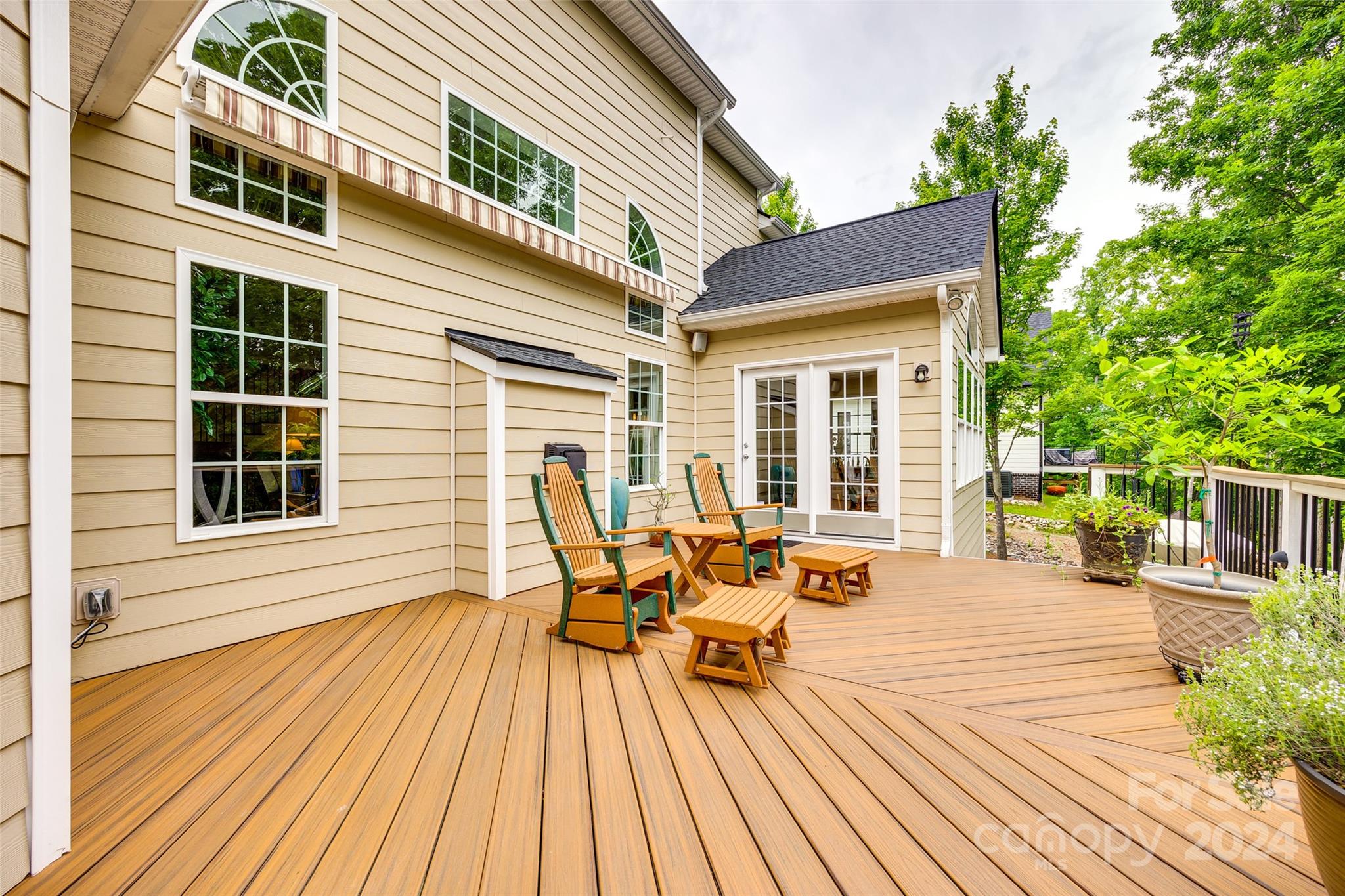 352 Calming Way Tega Cay, SC 29708 - Photo 37 of 48 a balcony with wooden floor table and chairs