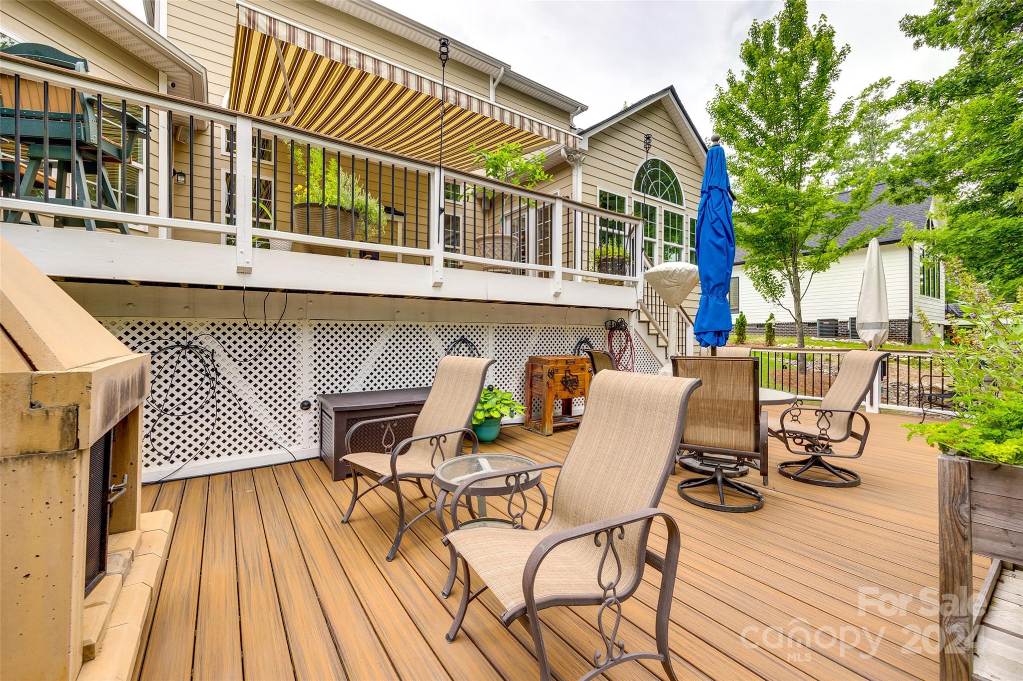 352 Calming Way Tega Cay, SC 29708 - Photo 40 of 48 a view of a patio with table and chairs with wooden floor and fence