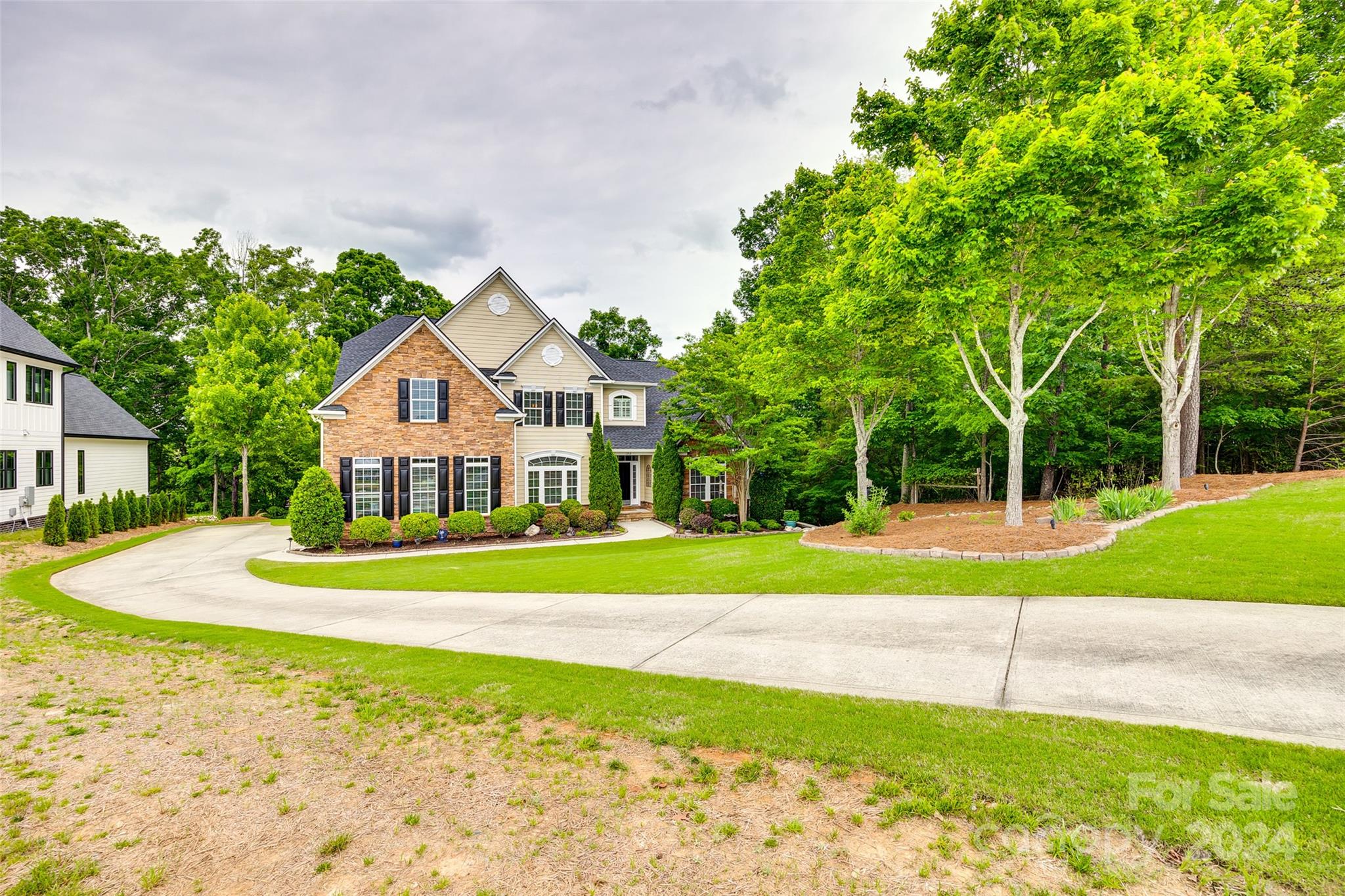 352 Calming Way Tega Cay, SC 29708 - Photo 44 of 48 a view of a house with a big yard and potted plants