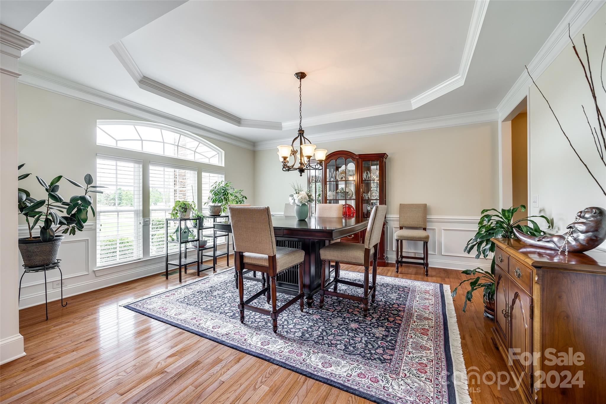 352 Calming Way Tega Cay, SC 29708 - Photo 8 of 48 a dining room with furniture window and wooden floor