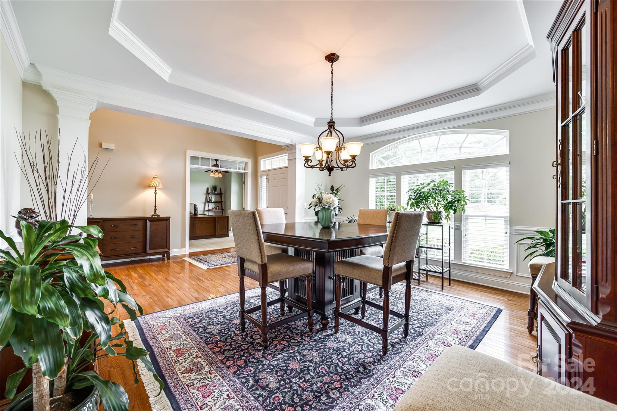 352 Calming Way Tega Cay, SC 29708 - Photo 9 of 48 a view of a dining room with furniture window and wooden floor