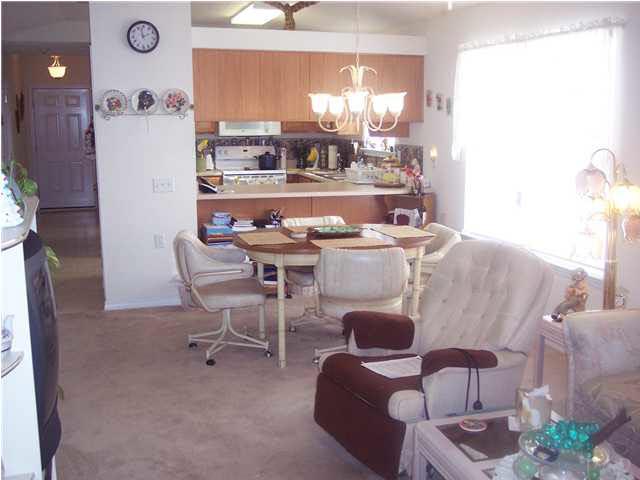 1098 Brownfield Road Pensacola, FL 32526 - Photo 5 of 16 View of kitchen and dining area with eat at bar.