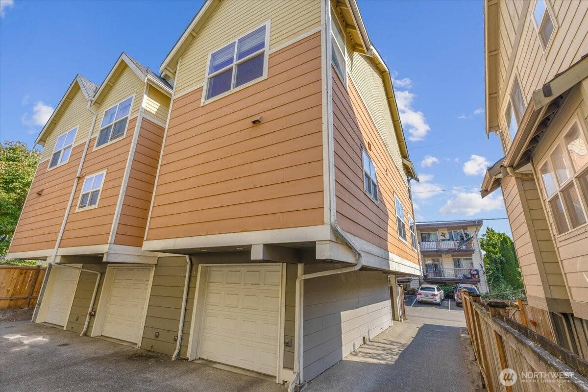 1719 Southwest Henderson Street Seattle, WA 98106 - Photo 1 of 22 a view of a building with a street