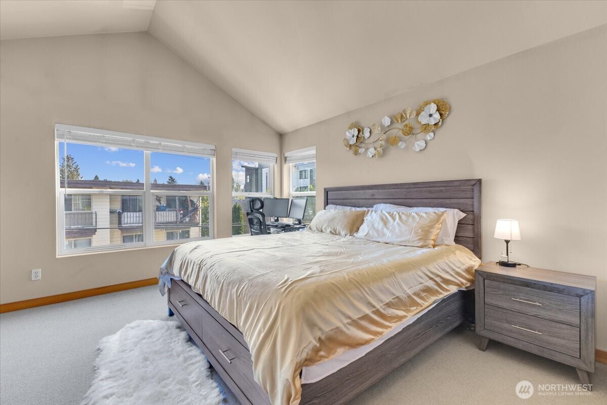 1719 Southwest Henderson Street Seattle, WA 98106 - Photo 11 of 22 a bed sitting in a bedroom next to a window