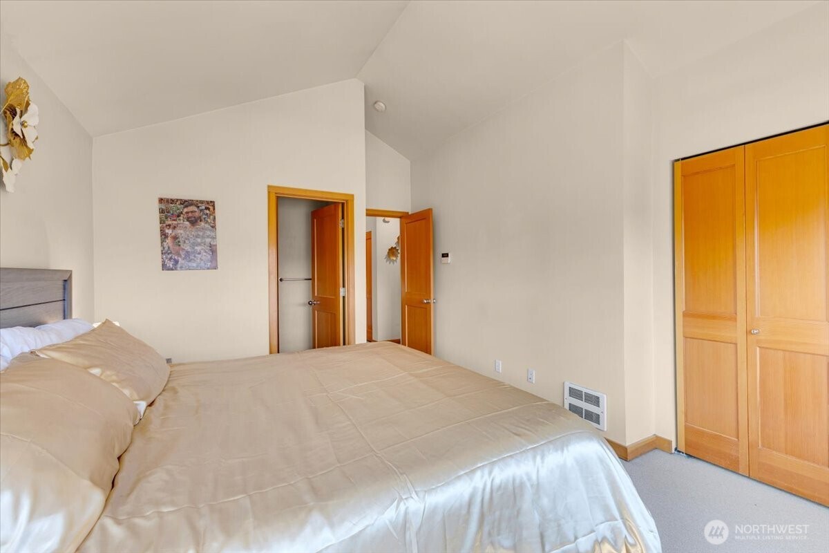 1719 Southwest Henderson Street Seattle, WA 98106 - Photo 13 of 22 a bedroom with a bed and a window