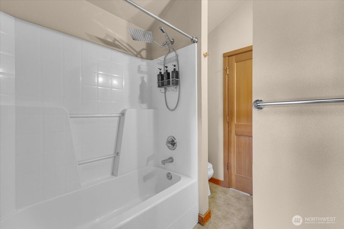 1719 Southwest Henderson Street Seattle, WA 98106 - Photo 14 of 22 a bathroom with a shower