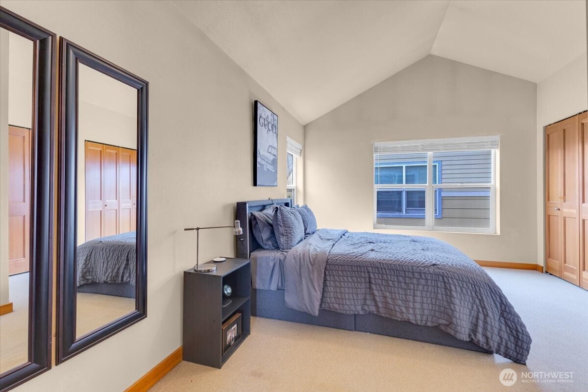 1719 Southwest Henderson Street Seattle, WA 98106 - Photo 16 of 22 a bedroom with a bed and a window