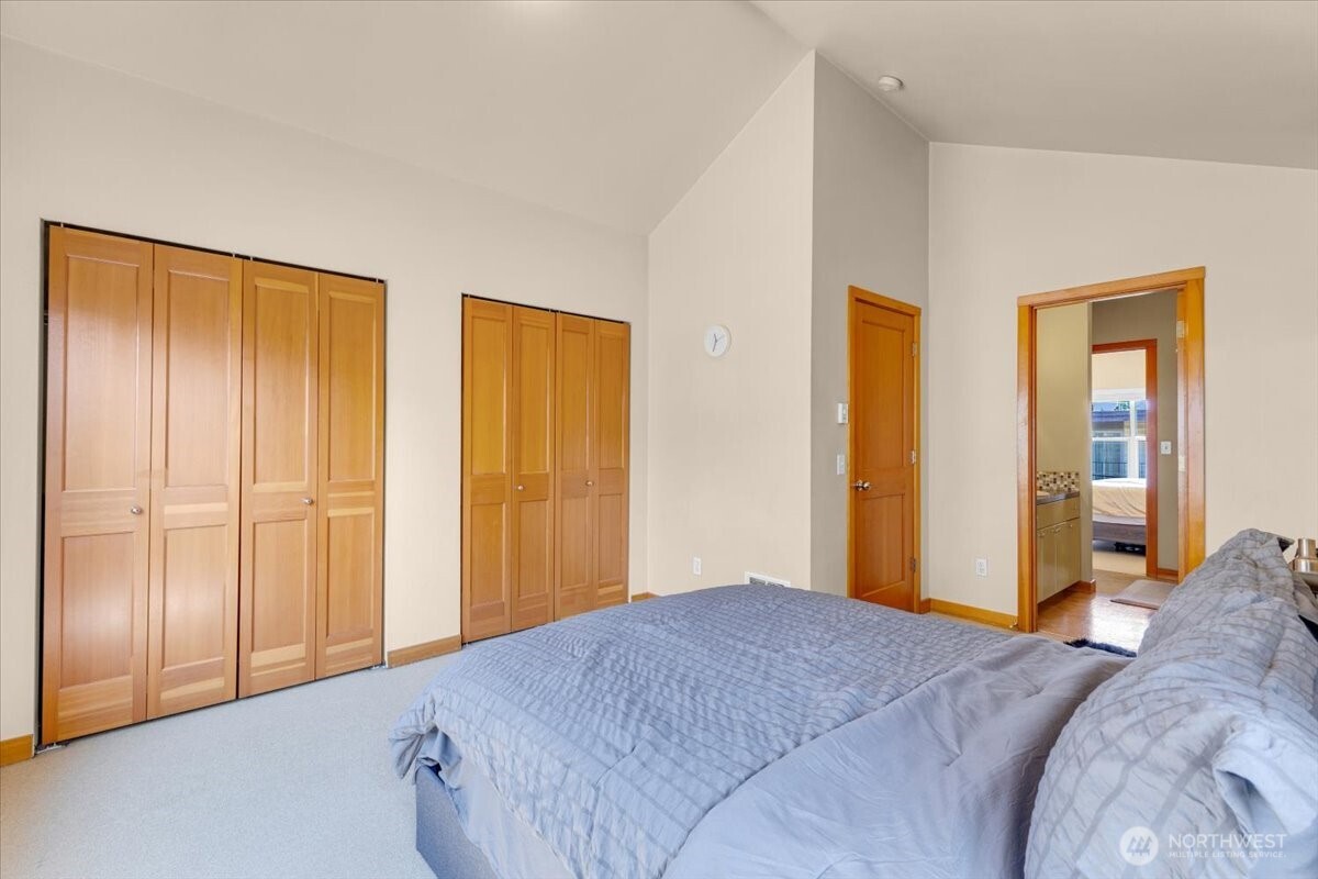 1719 Southwest Henderson Street Seattle, WA 98106 - Photo 17 of 22 a bedroom with a bed and wooden floor