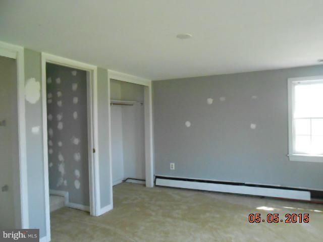 1350 Plum Point Road Huntingtown, MD 20639 - Photo 6 of 7 an empty room with windows