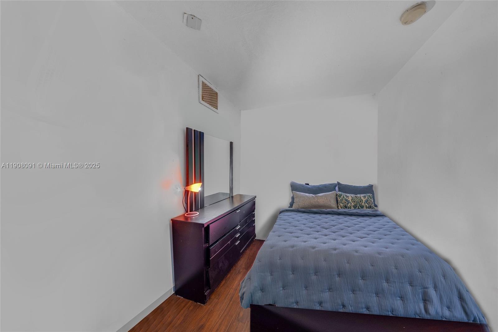 1334 Southwest 4th Street Miami, FL 33135 - Photo 11 of 46 a bedroom with a bed and wooden floor
