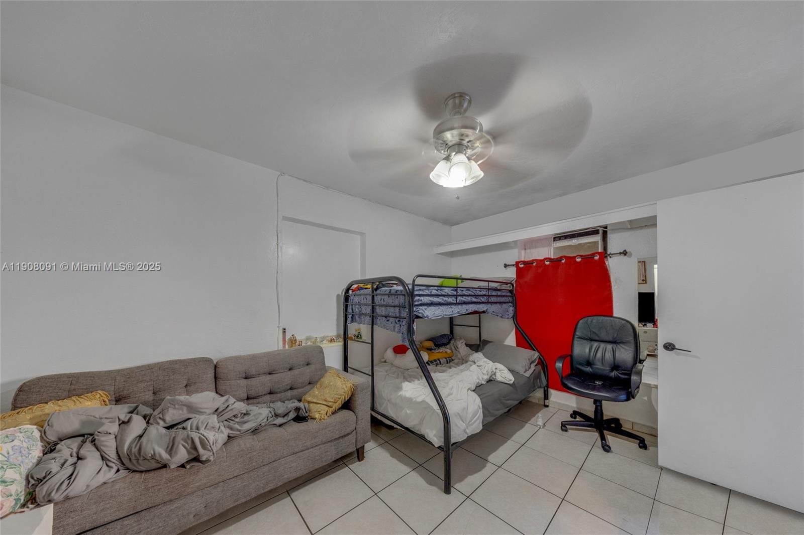1334 Southwest 4th Street Miami, FL 33135 - Photo 22 of 46 a bedroom with bed and a couch