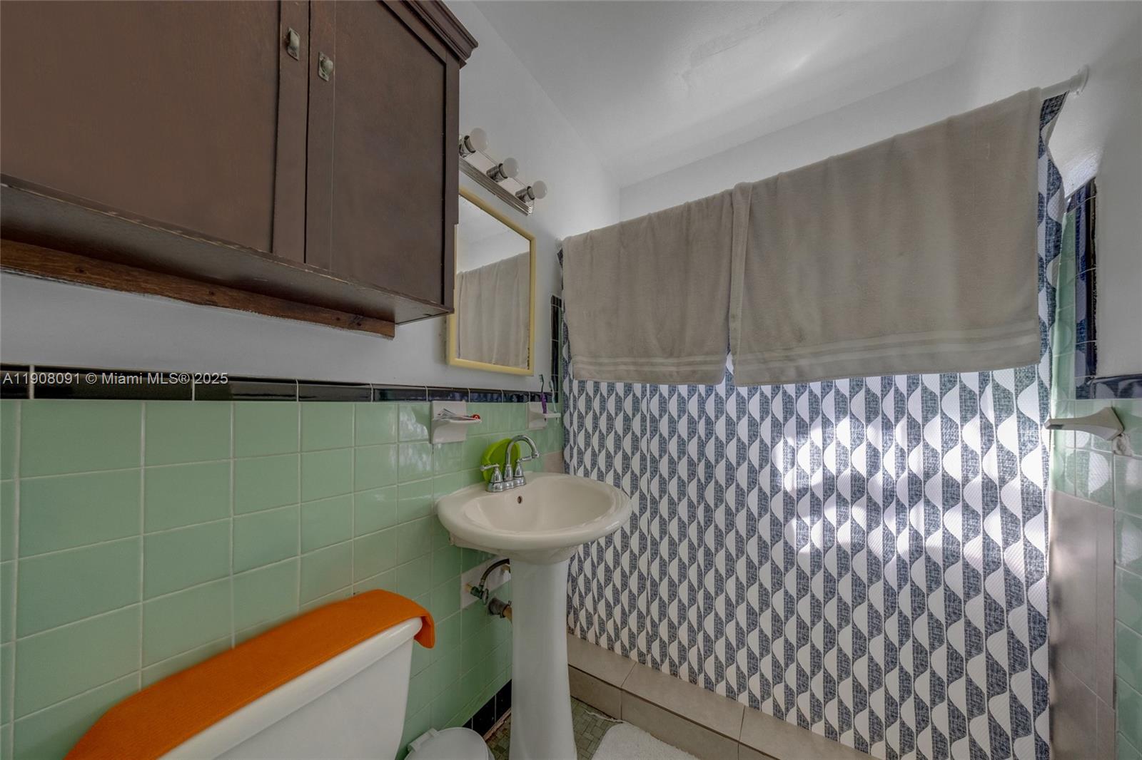1334 Southwest 4th Street Miami, FL 33135 - Photo 23 of 46 a bathroom with a sink and a mirror