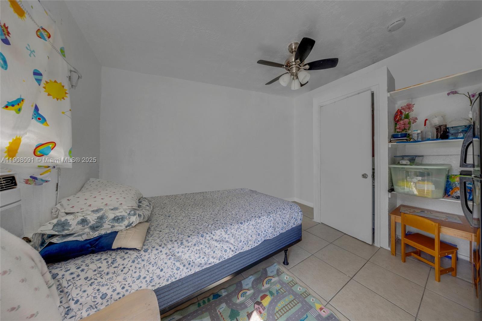 1334 Southwest 4th Street Miami, FL 33135 - Photo 31 of 46 a bedroom with a bed and a window in it