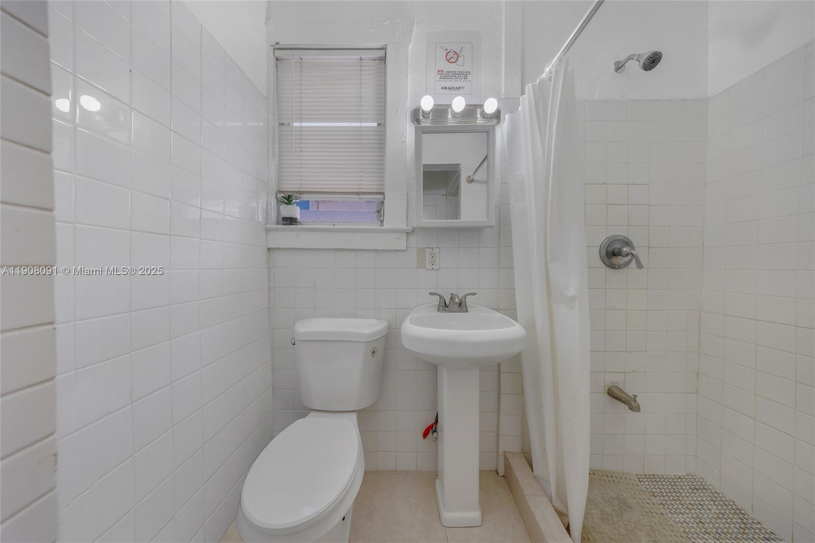 1334 Southwest 4th Street Miami, FL 33135 - Photo 40 of 46 a bathroom with a toilet sink and shower