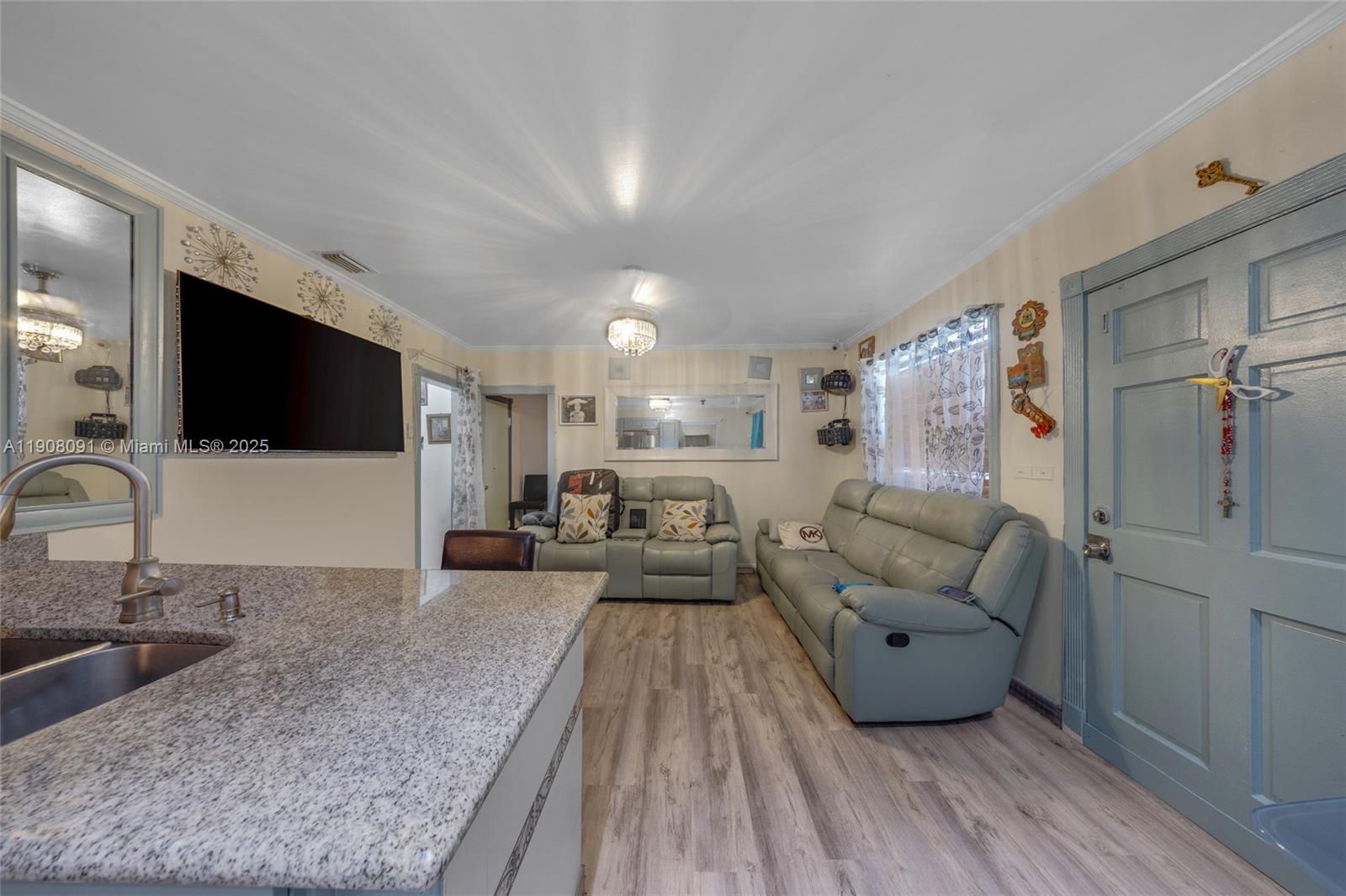 1334 Southwest 4th Street Miami, FL 33135 - Photo 9 of 46 a living room with furniture and a flat screen tv