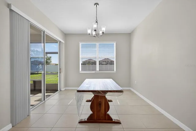 a dining room with a chandelier and chandelier