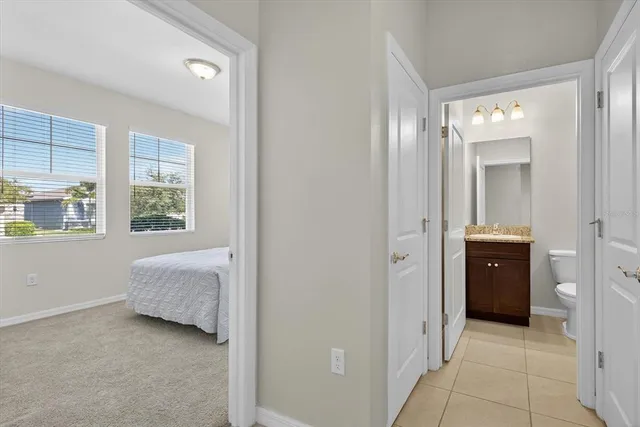 a en suite bathroom with a sink and a mirror