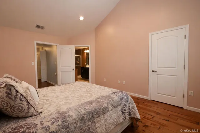 a bedroom with a bed and a closet