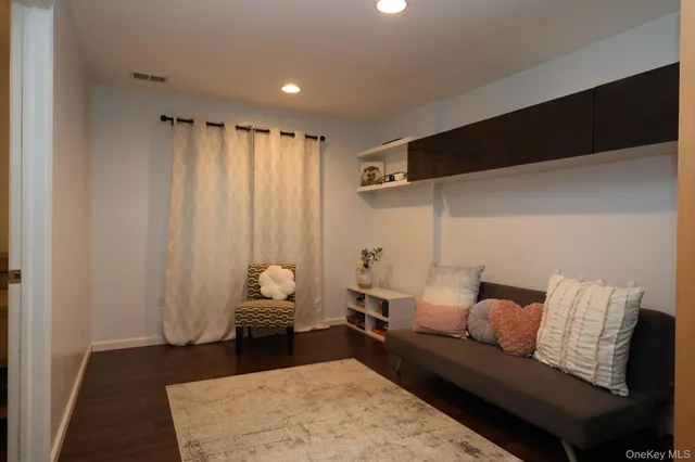 a living room with furniture and a rug