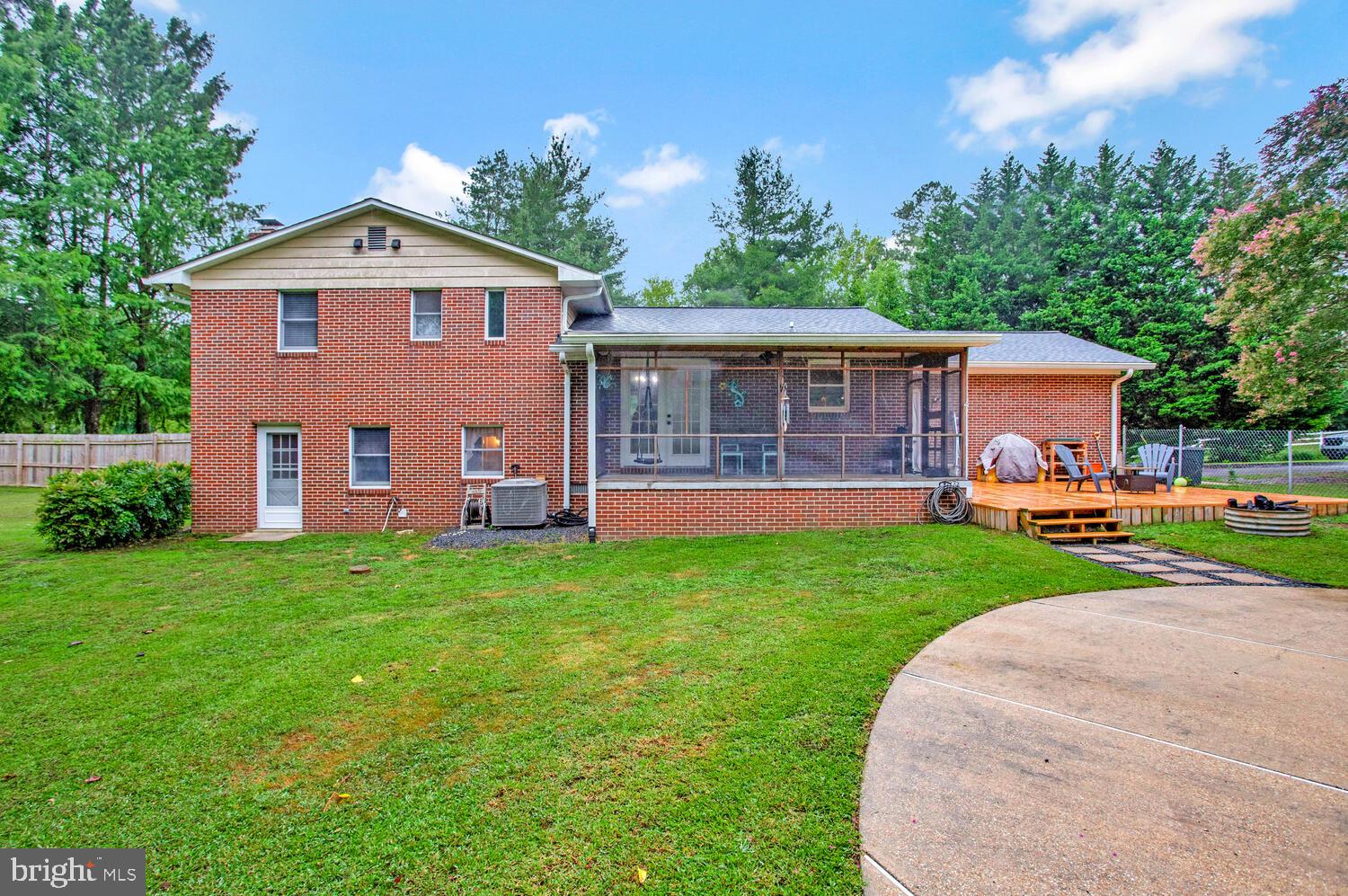 1110 Cox Road Huntingtown, MD 20639 - Photo 20 of 20 a front view of a house with a garden and yard