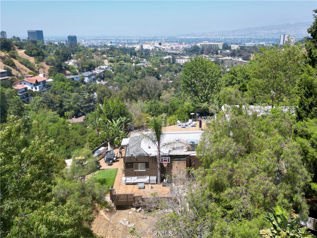 an aerial view of a house with a yard