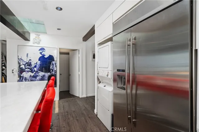 a bedroom with a bed a mirror and desk