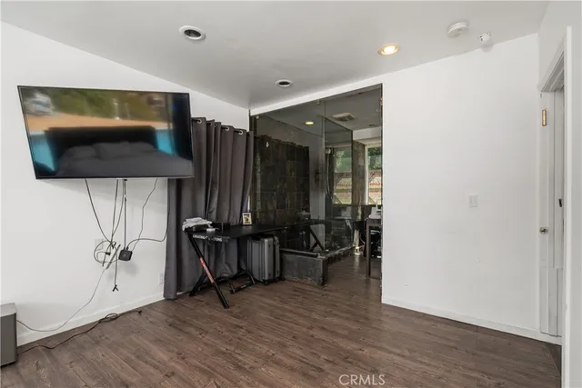 a bathroom with a shower toilet and sink