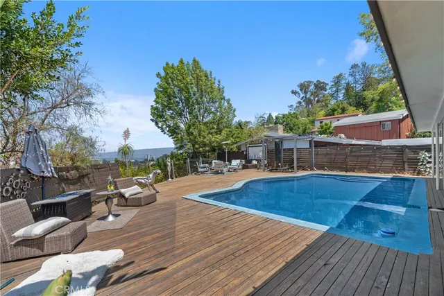 a view of a swimming pool with a patio