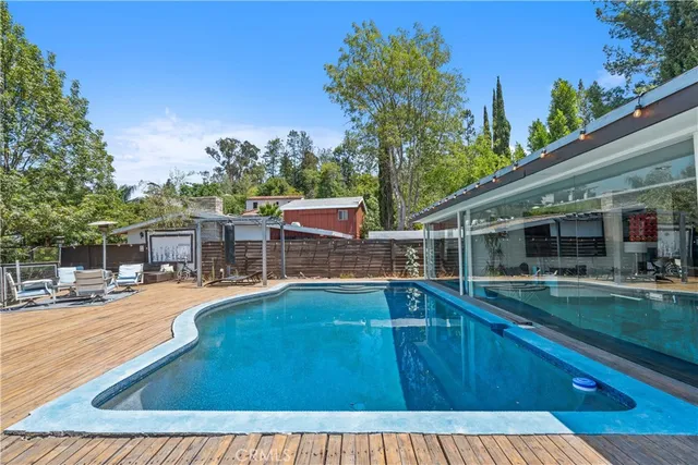 a view of a swimming pool with an outdoor seating