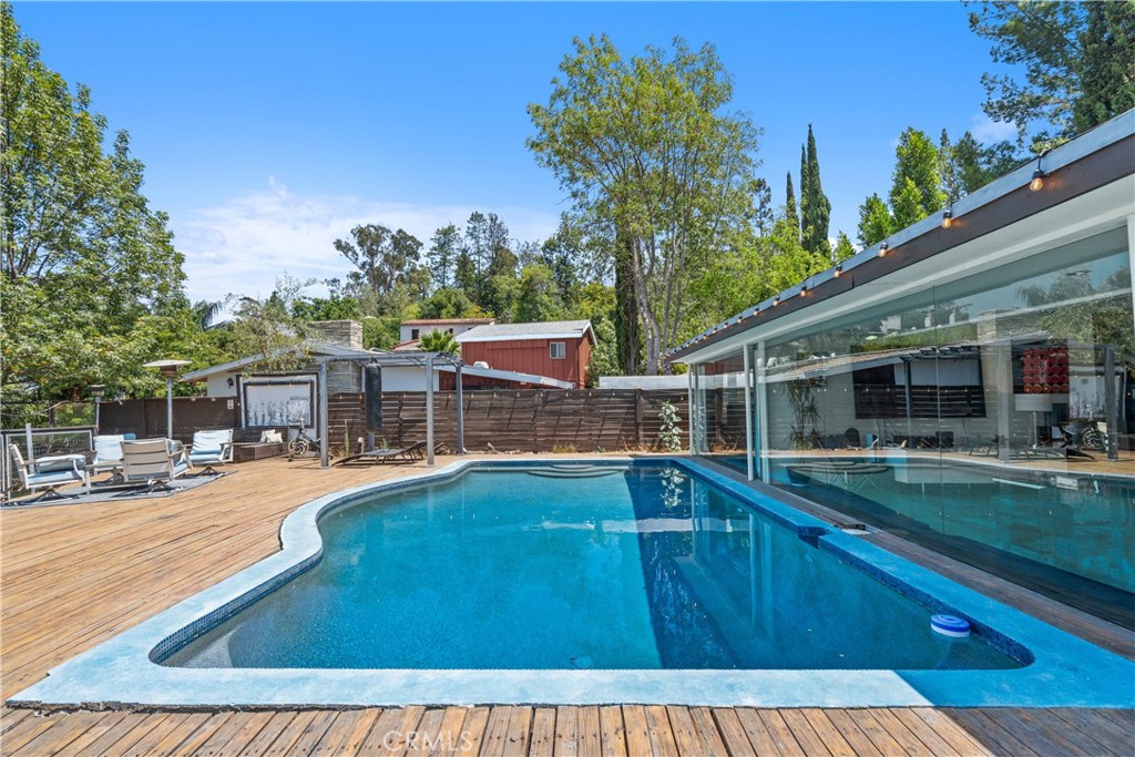 7241 Woodrow Wilson Drive Los Angeles, CA 90068 - Photo 27 of 43 a view of a swimming pool with a patio