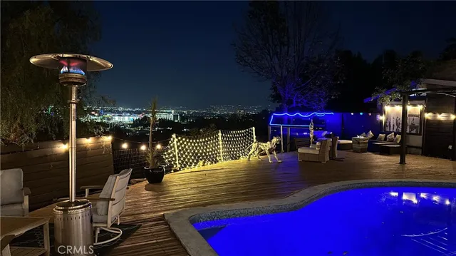 a view of a patio with a table and chairs
