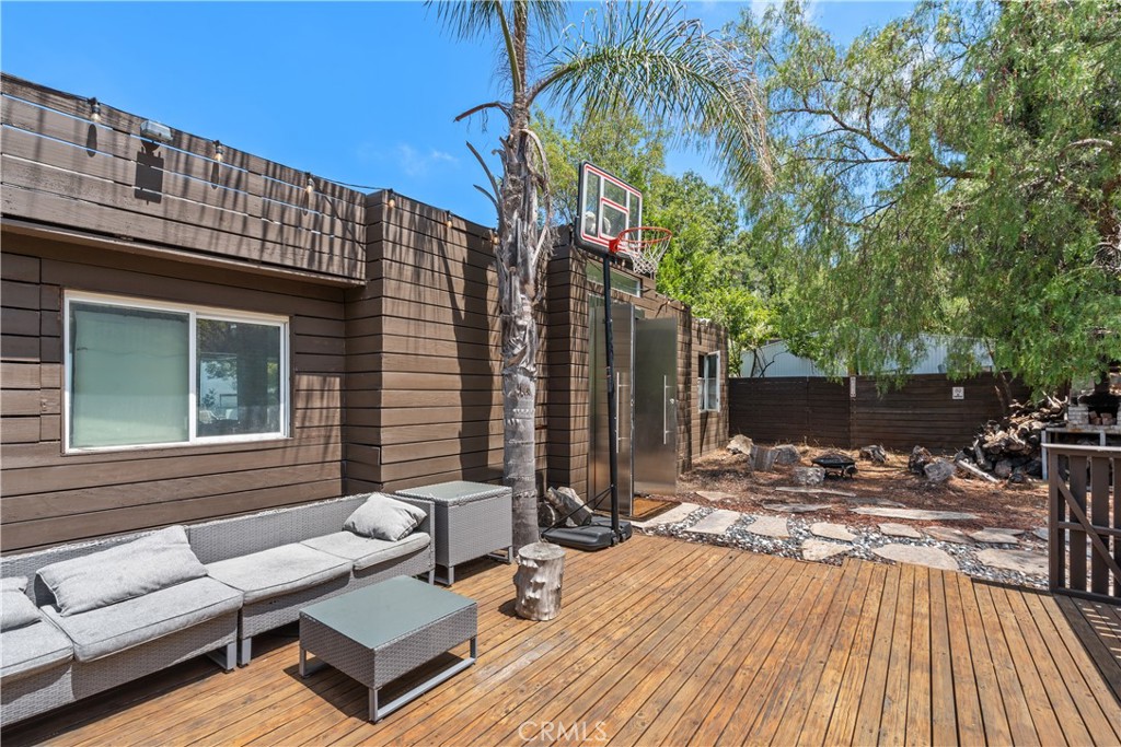 7241 Woodrow Wilson Drive Los Angeles, CA 90068 - Photo 34 of 43 a view of backyard with a patio and outdoor seating