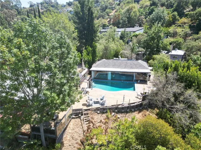 an aerial view of a house with outdoor space