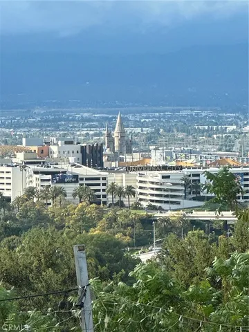 a roof deck with wooden floor and fence