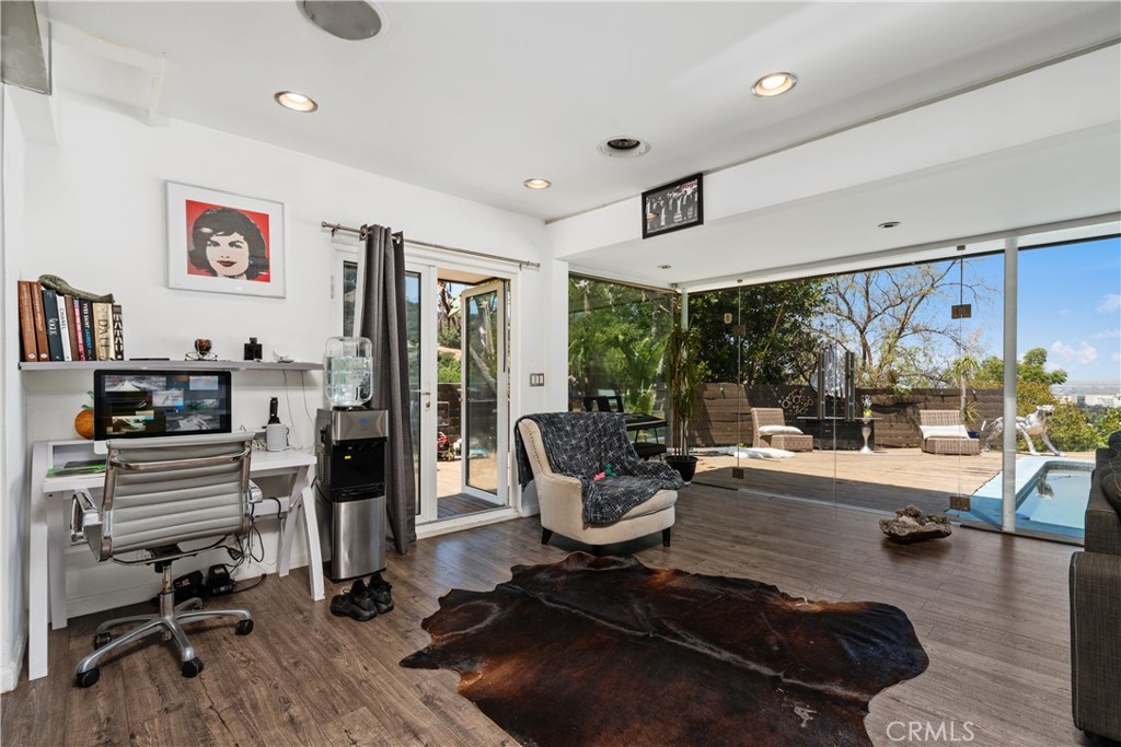 7241 Woodrow Wilson Drive Los Angeles, CA 90068 - Photo 9 of 43 a room with gym equipment and a large window