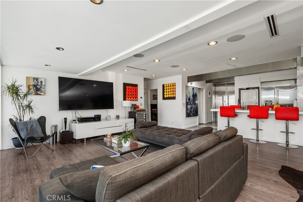 7241 Woodrow Wilson Drive Los Angeles, CA 90068 - Photo 10 of 43 a living room with furniture and a flat screen tv