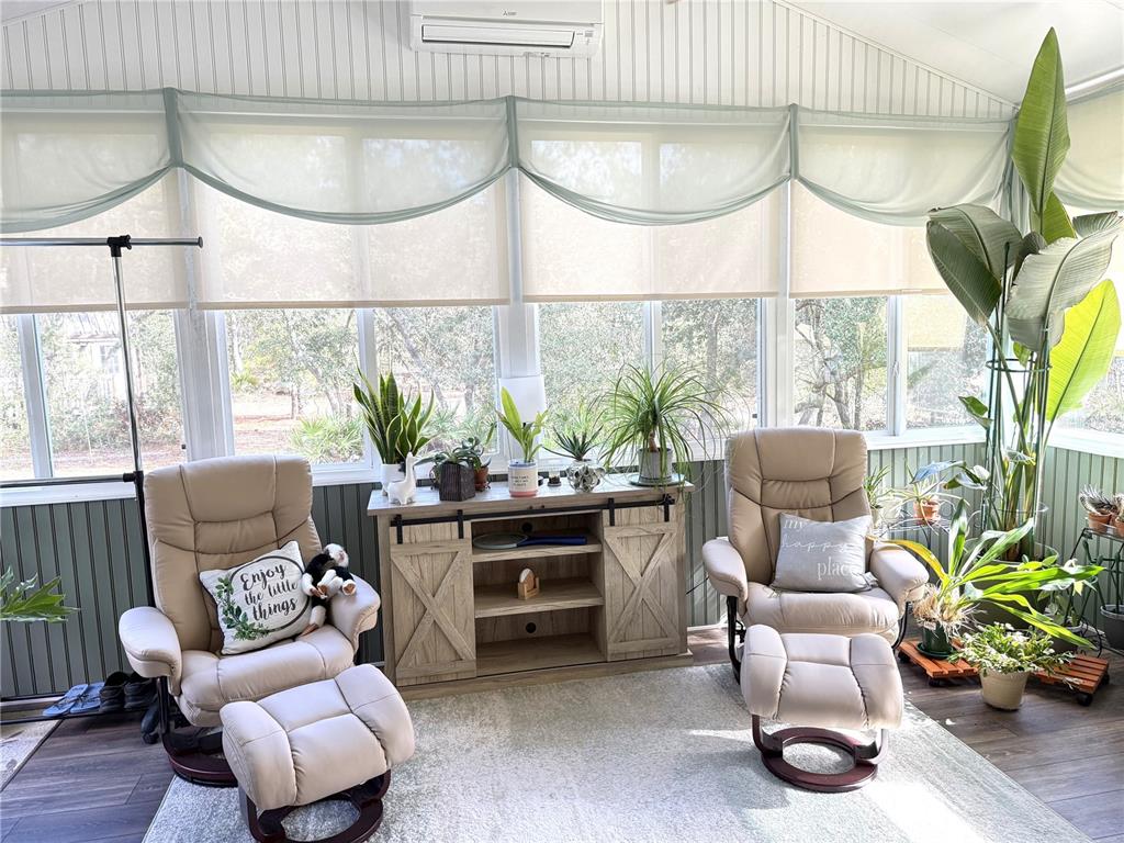8261 Northeast 118 Terrace Bronson, FL 32621 - Photo 11 of 43 a living room with furniture flowerpot and window