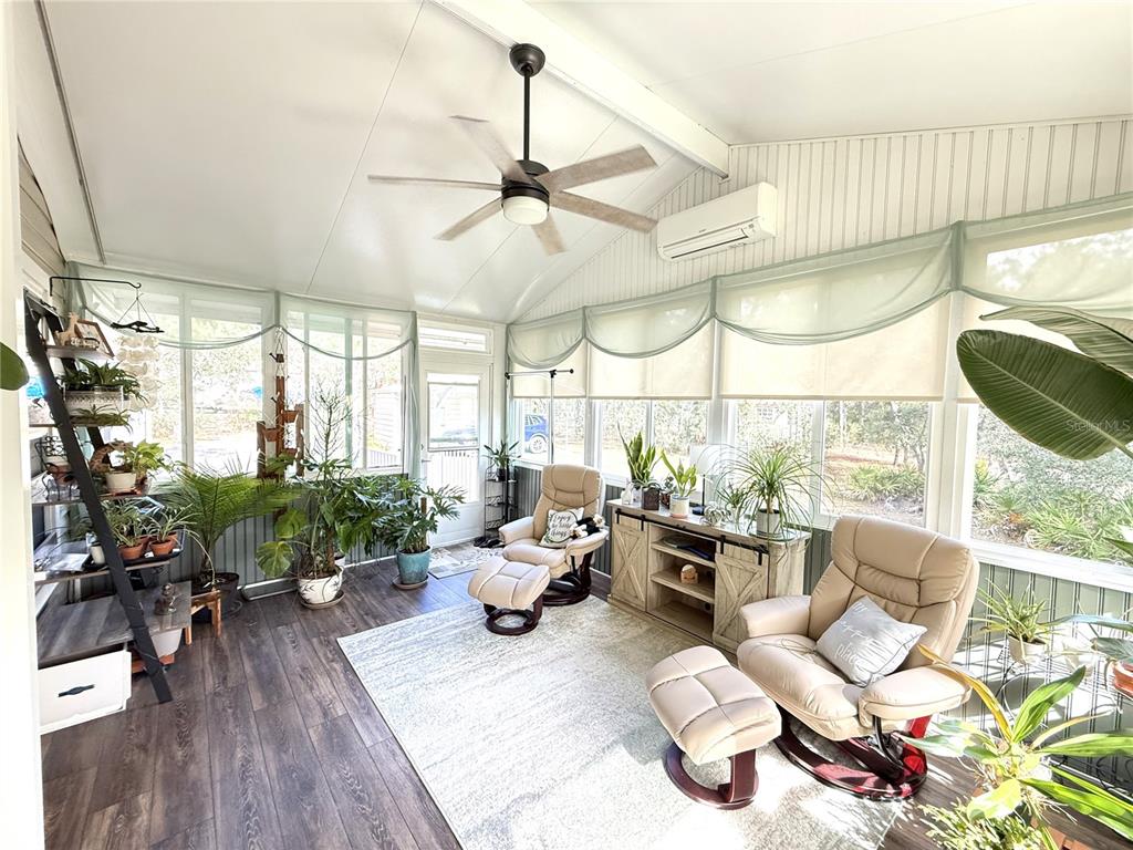8261 Northeast 118 Terrace Bronson, FL 32621 - Photo 12 of 43 a living room with lots of furniture and a large window