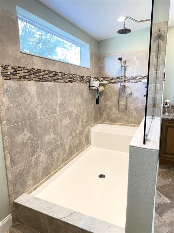 8261 Northeast 118 Terrace Bronson, FL 32621 - Photo 18 of 43 a bathroom with a bathtub and shower