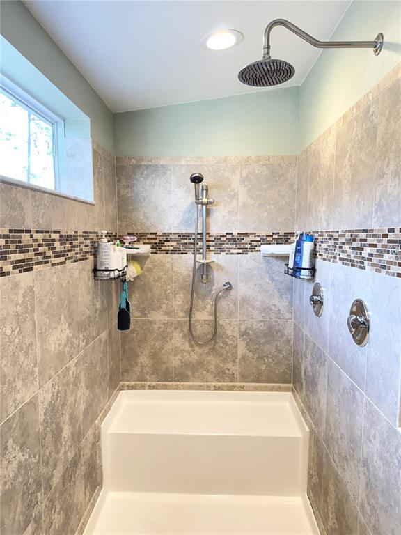 8261 Northeast 118 Terrace Bronson, FL 32621 - Photo 19 of 43 a bathroom with a granite countertop sink and a mirror