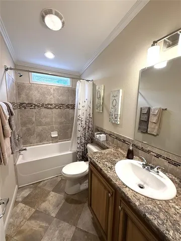 a bedroom with furniture and a book shelf