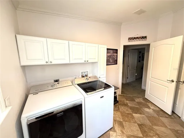 an aerial view of a house with outdoor space and street view