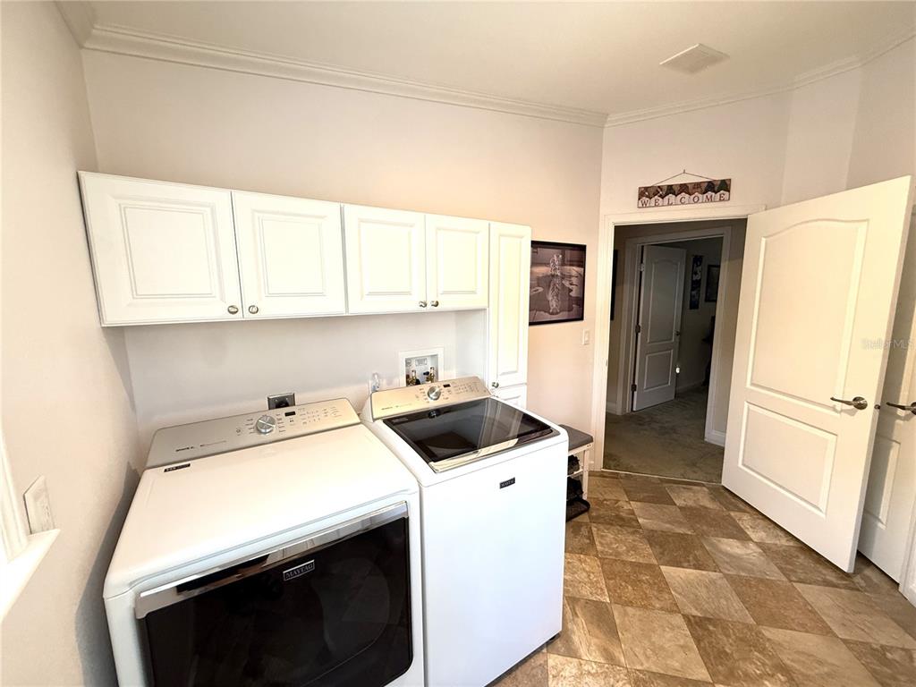 8261 Northeast 118 Terrace Bronson, FL 32621 - Photo 24 of 43 a utility room with dryer and washer