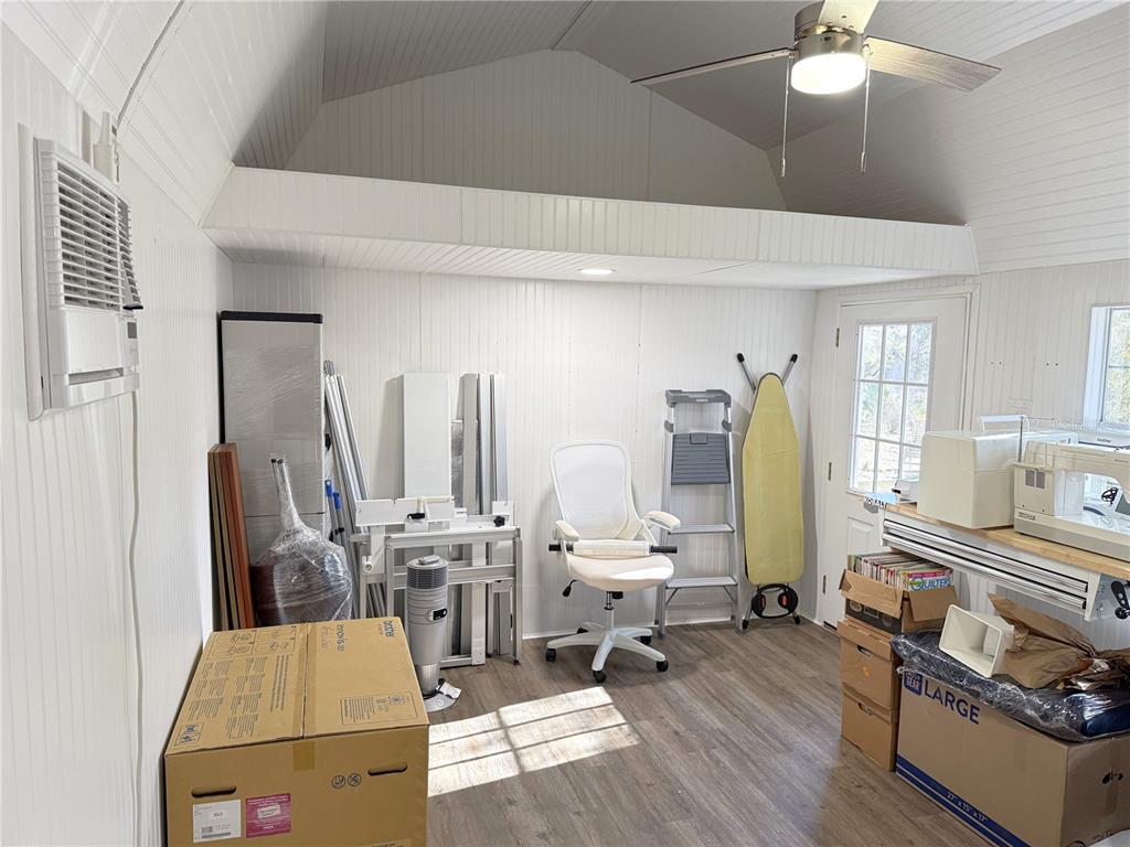 8261 Northeast 118 Terrace Bronson, FL 32621 - Photo 29 of 43 a living room with furniture and a wooden floor