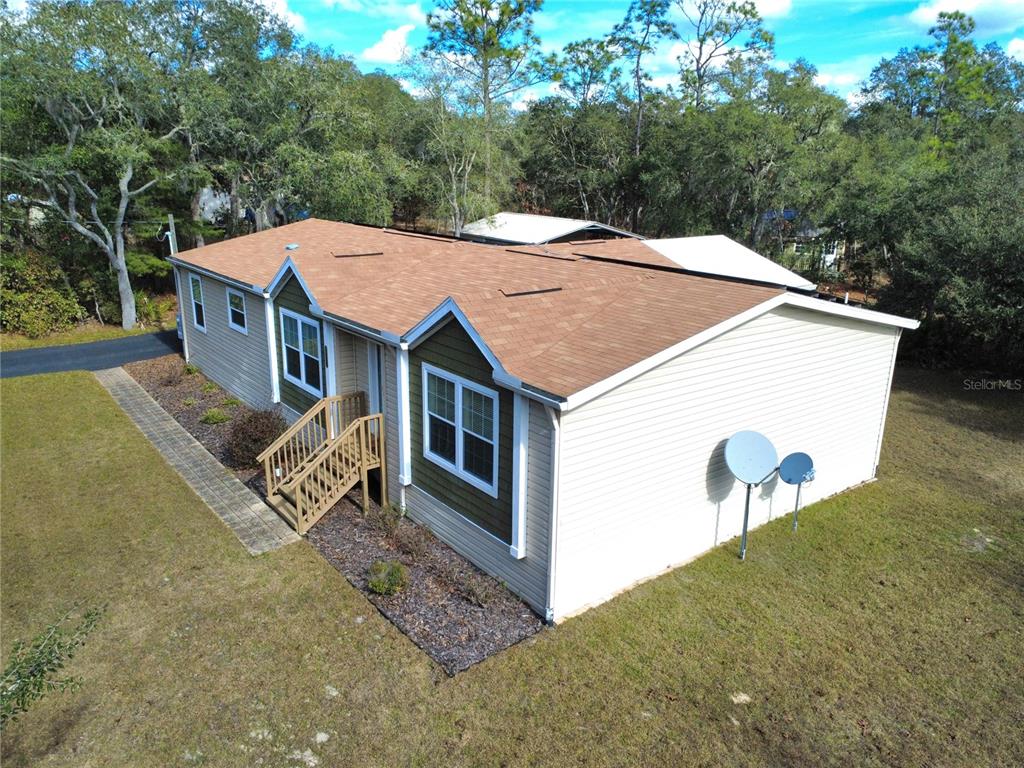 8261 Northeast 118 Terrace Bronson, FL 32621 - Photo 31 of 43 an aerial view of a house with table and chairs
