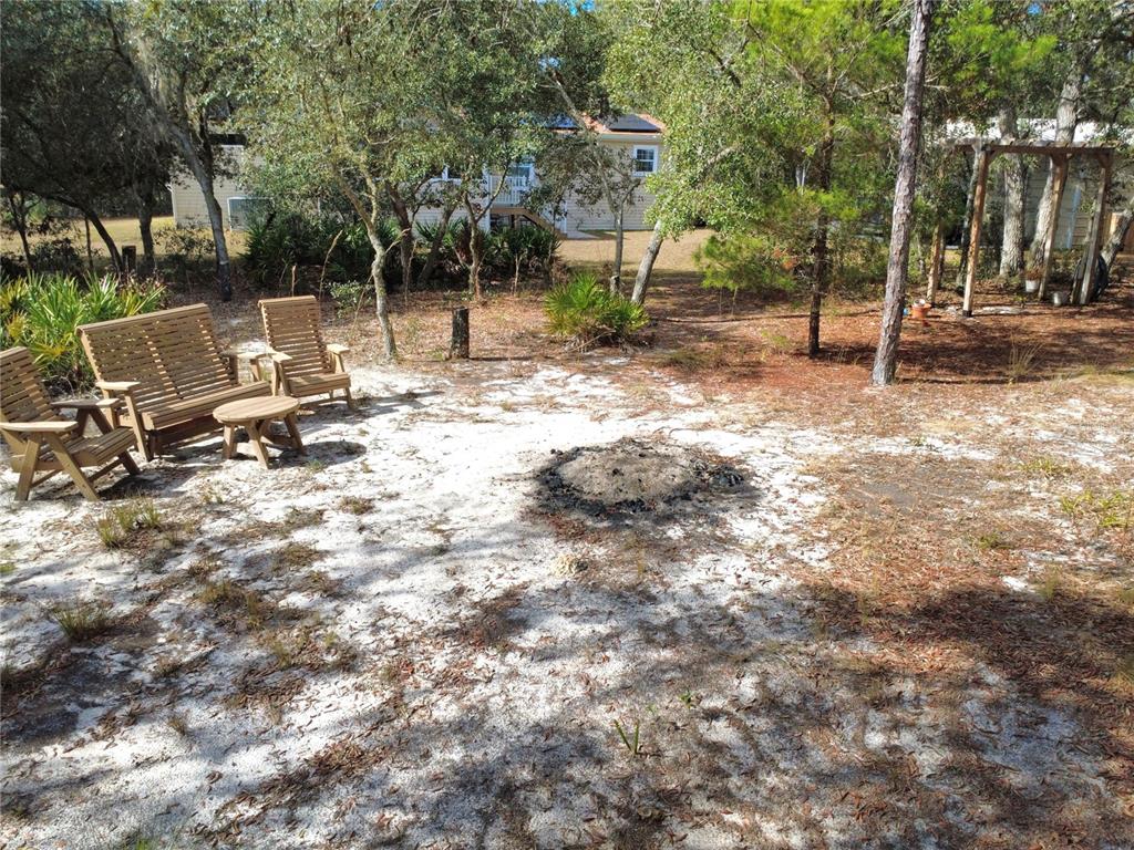 8261 Northeast 118 Terrace Bronson, FL 32621 - Photo 39 of 43 a view of a park with swings and slides