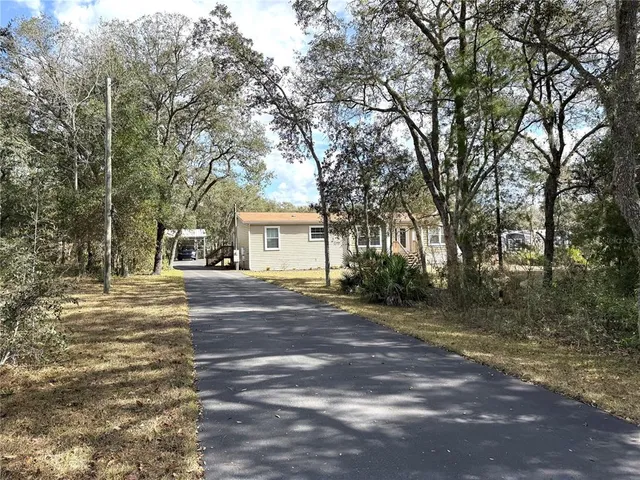 a view of a backyard of a house