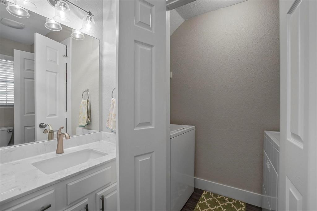 5113 Mountain Spring Trail Fort Worth, TX 76123 - Photo 16 of 35 a bathroom with a sink and a mirror with shower